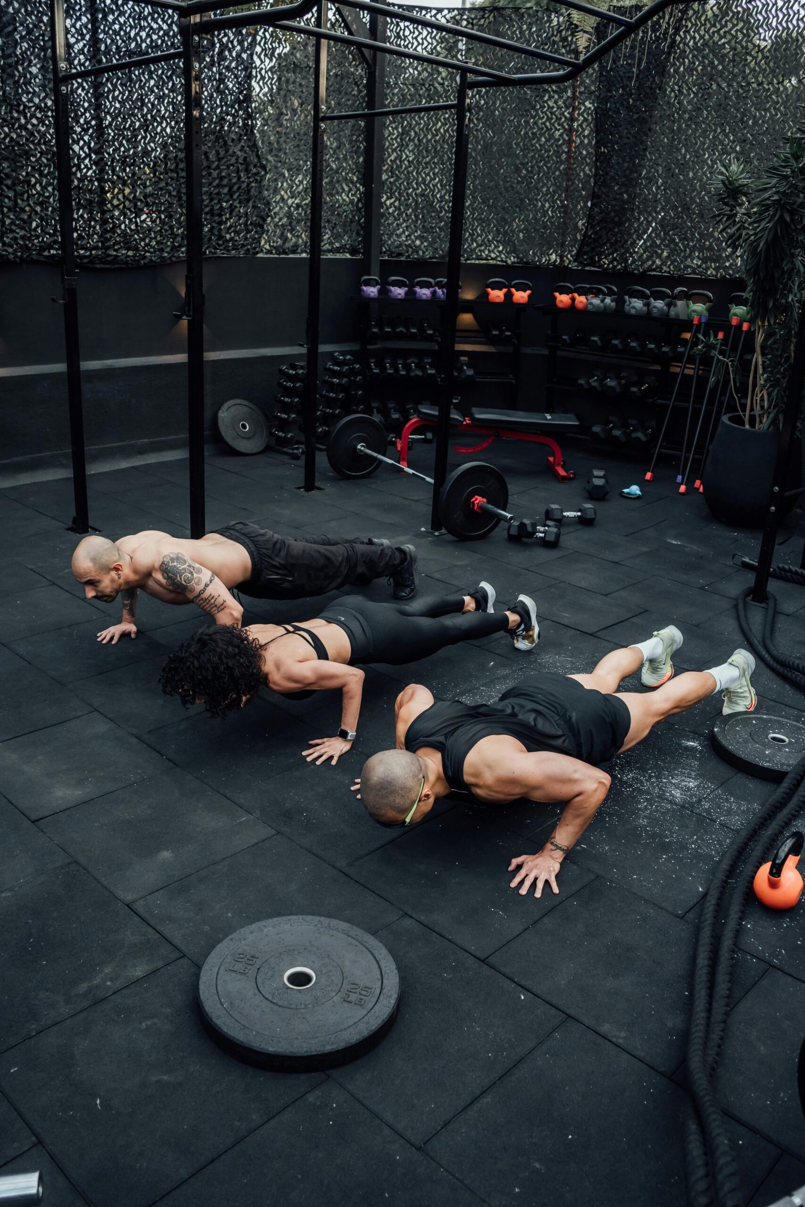 Person looking nervous before entering the gym.” Beginner-friendly gym workout designed to boost confidence.” Trainer guiding a new gym-goer to improve comfort and technique. Gym environment with people working out confidently.” Step-by-step guide to overcoming gym anxiety and building confidence.