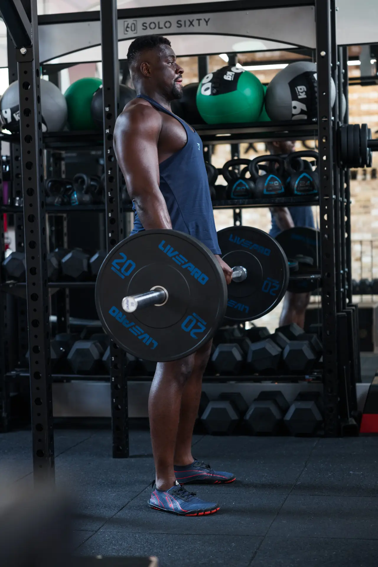 Athlete performing a heavy deadlift to build strength and power. Trainer coaching proper deadlift form for injury prevention.” Step-by-step guide to mastering the deadlift for athletic performance.” Comparison of different deadlift variations for strength development. Weightlifter executing a perfect deadlift with correct technique