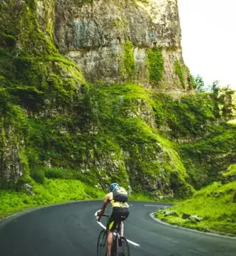 Person jogging at a steady pace, training in Zone 2 cardio.” Heart rate monitor displaying Zone 2 cardio intensity.” Cyclist performing low-intensity endurance training.” Treadmill workout designed for Zone 2 heart rate training.” Chart explaining heart rate zones for optimal cardio performance.”