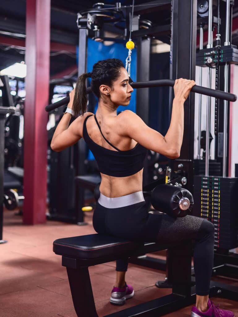 a women doing lat pull down